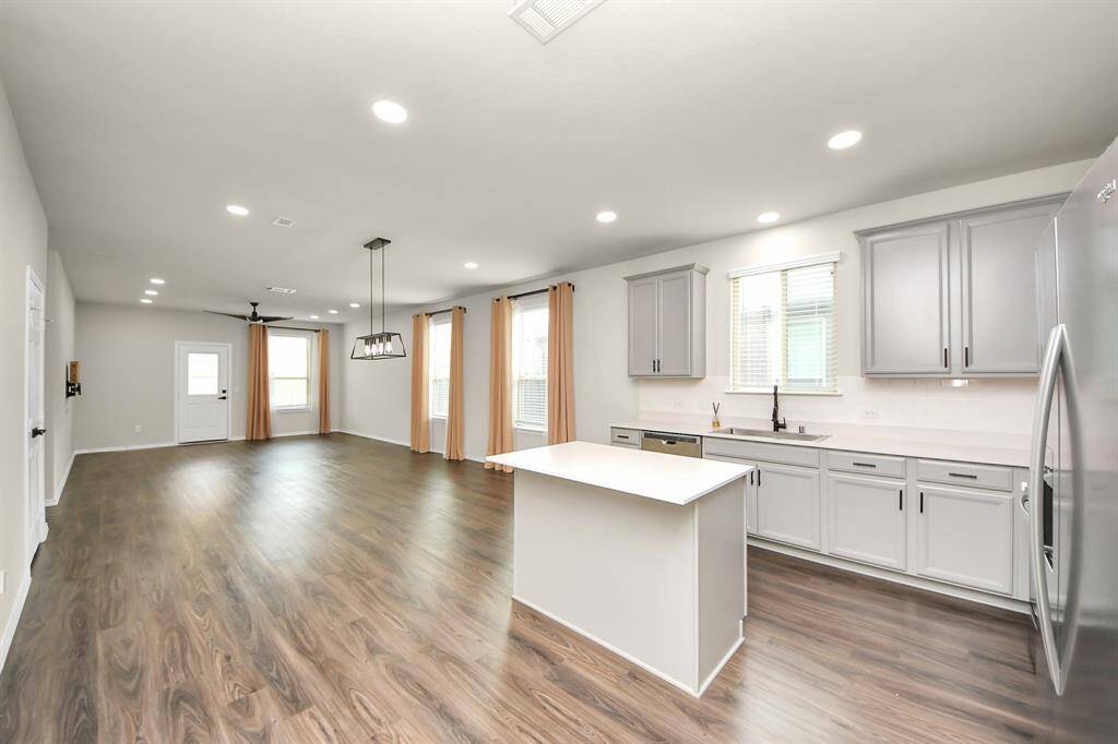 Kitchen - Premium Stainless Steel Farmhouse sink. Recessed light additions. Under-counter lighting additions