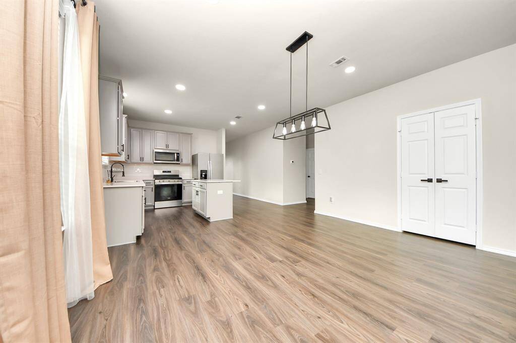 Expansive Living Area; Perfect for family gatherings. Recessed light additions.