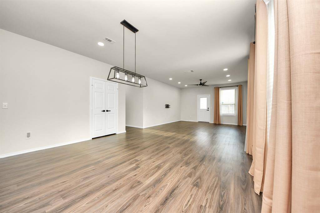 Expansive Living Area; Perfect for family gatherings. Recessed light additions.