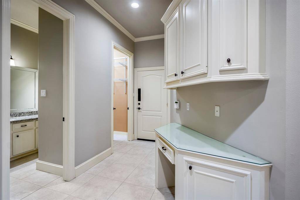 This is an ideal guest suite with a vanity / work station that includes plenty of cabinetry.