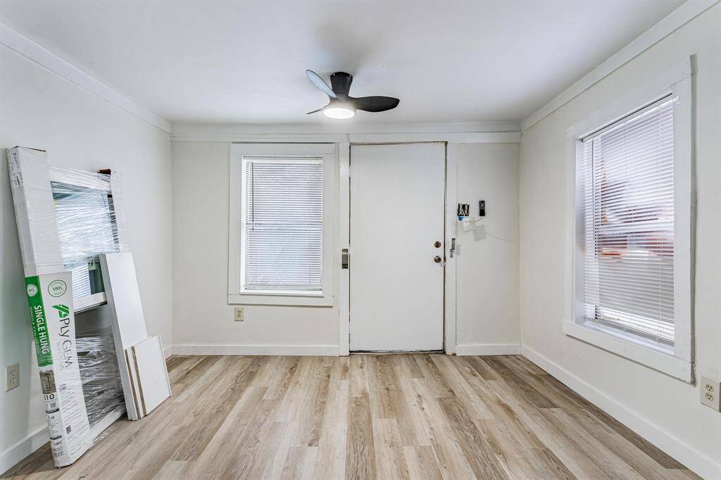Explore the inviting entryway from the kitchen, offering a welcoming and functional transition space.