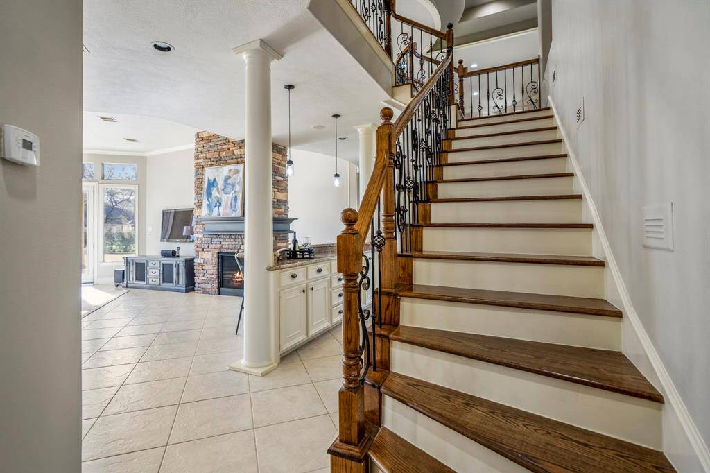 This is the return stair case with iron scroll detailing and wood tread stairs.