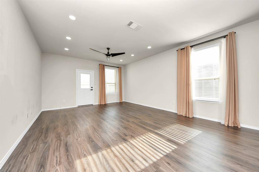 Expansive Living Area; Perfect for family gatherings. Recessed light additions. Stylish ceiling fans ensure comfort in key spaces.