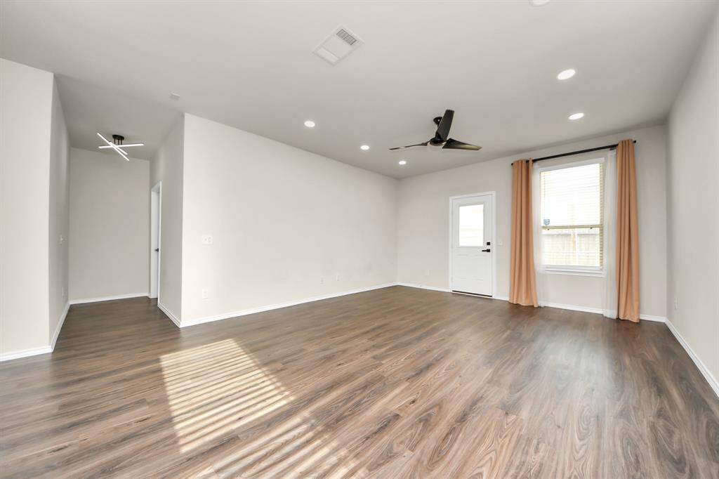 Expansive Living Area; Perfect for family gatherings. Recessed light additions. Stylish ceiling fans ensure comfort in key spaces.