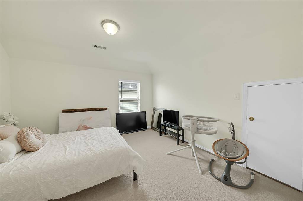 The third of the secondary bedrooms with an oversized walk-in closet