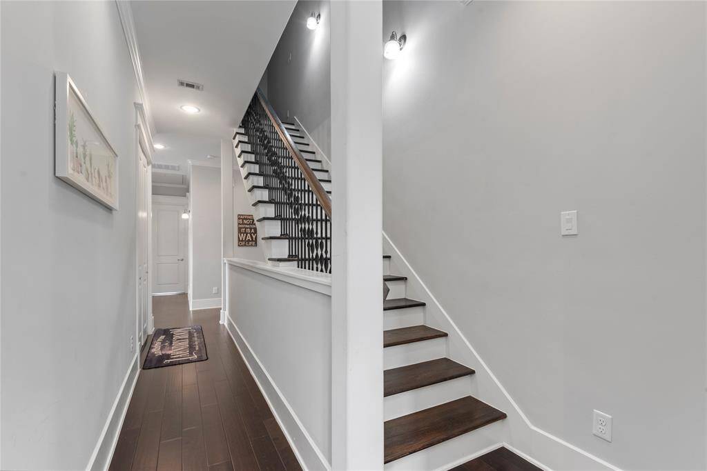 A beautiful staircase connecting the three levels of the home, showcasing elegant design elements.