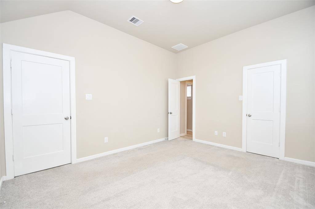The fourth upstairs bedroom is a spacious and versatile area, featuring a large window for natural light and a generous closet for ample storage. Perfect for a guest suite, home office, or personal retreat, this room provides both comfort and functionality in a well-designed layout.