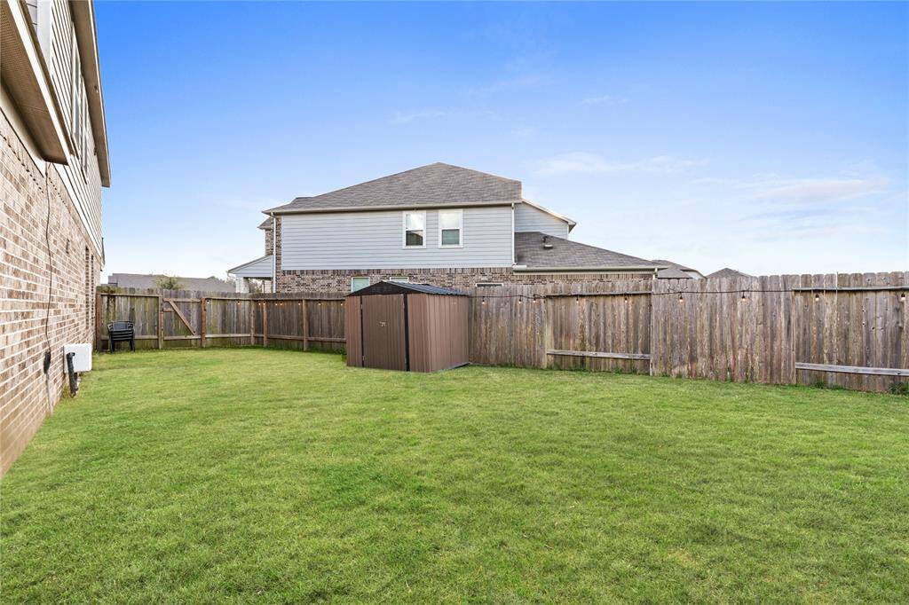 Shed on backyard included.