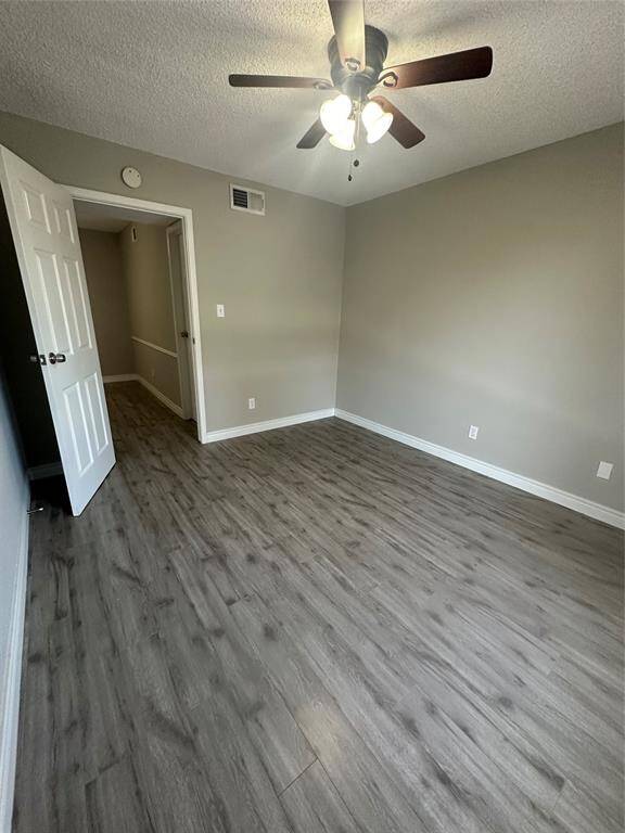 Secondary bedroom with laminate floors and tons of natural light.