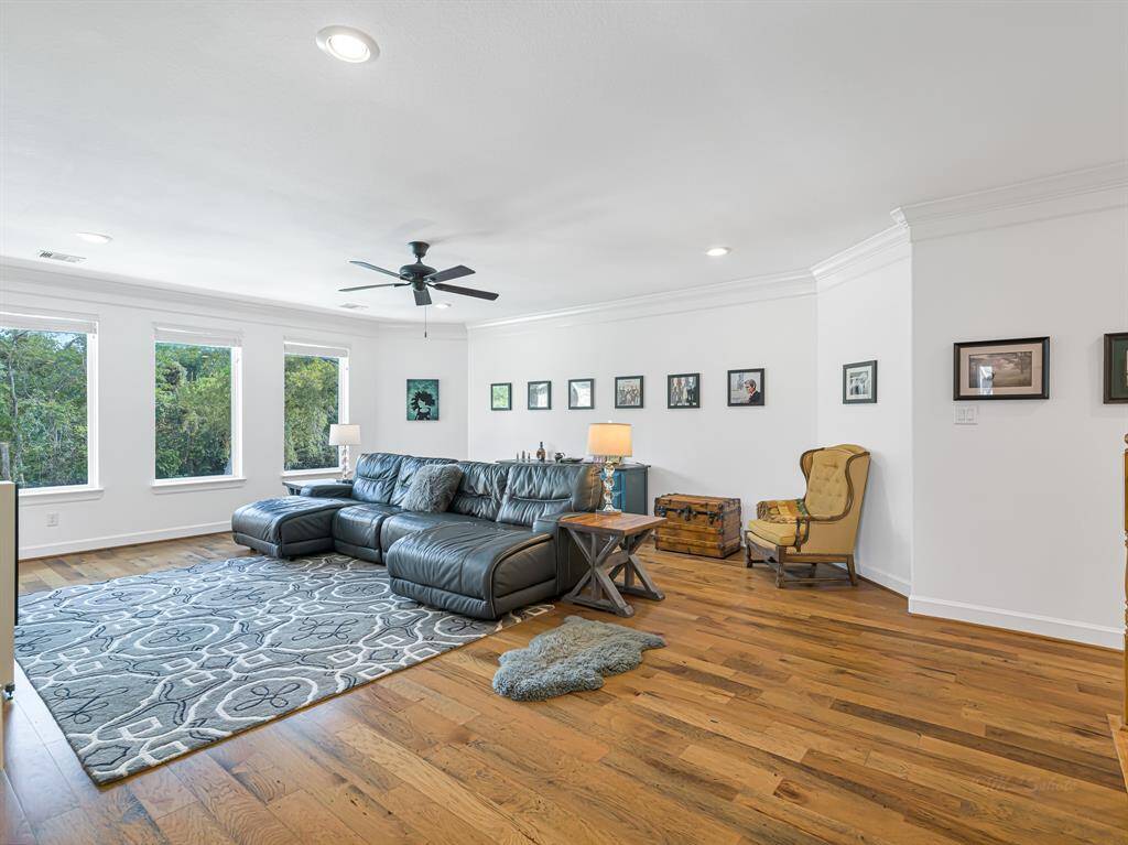 Upstairs game room - the beautiful hardwood flows through out the living areas of the home and continue upstairs