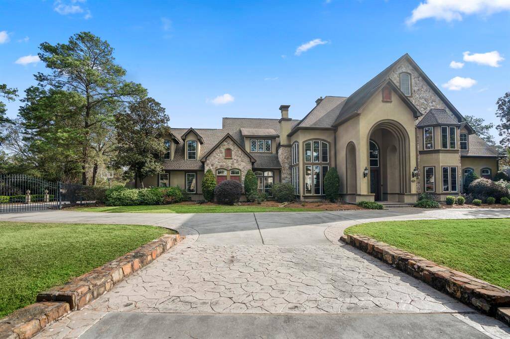Enjoy a country-style estate nestled amidst lush landscaping with ample space to enjoy the luxurious outdoors as well as the 5,575 Sq. Ft of indoor elegant living.