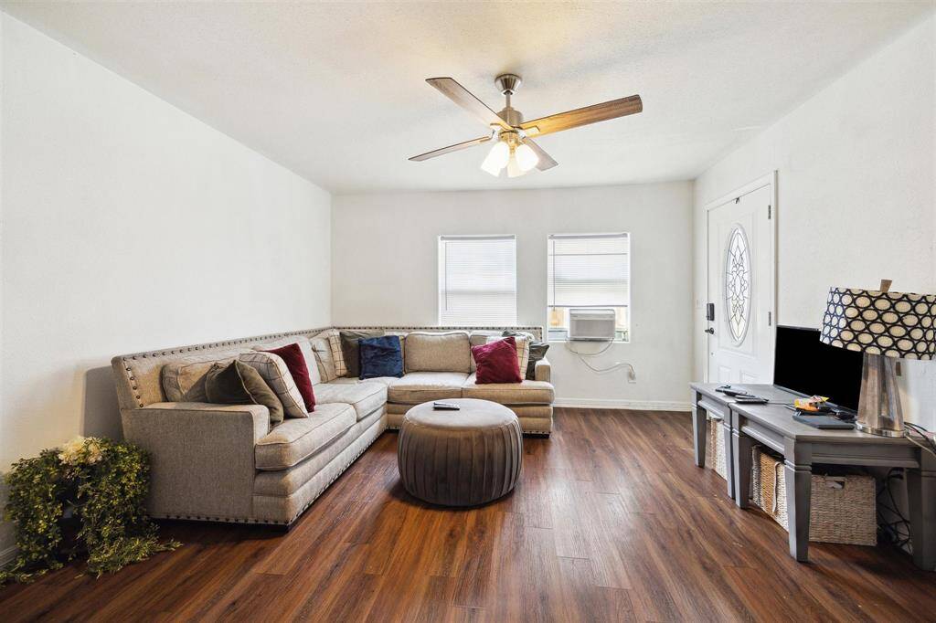 Living room boasts natural light throughout.