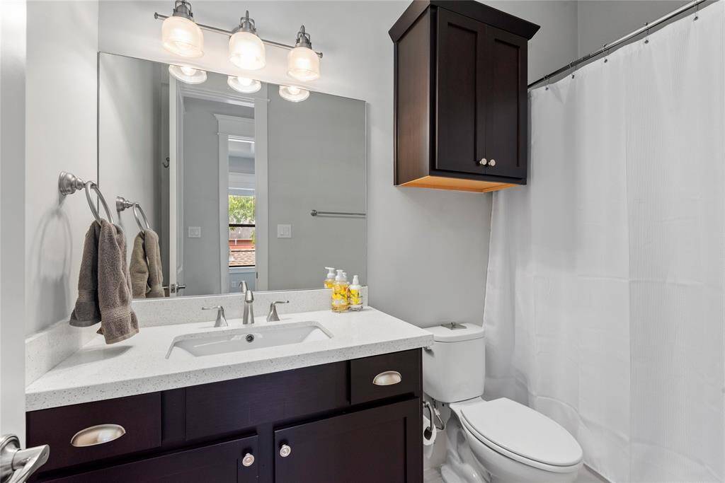 A well-appointed second bathroom with contemporary finishes and fixtures.