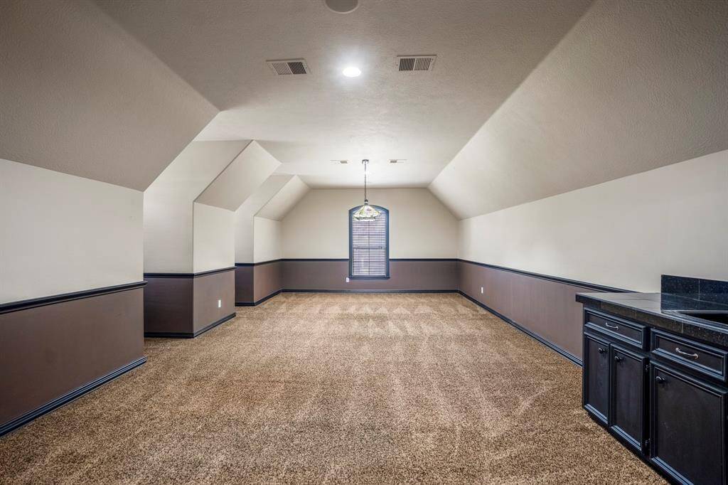 The media room is large enough for you to entertain with ease, especially with a wet bar that also features plenty of storage options.