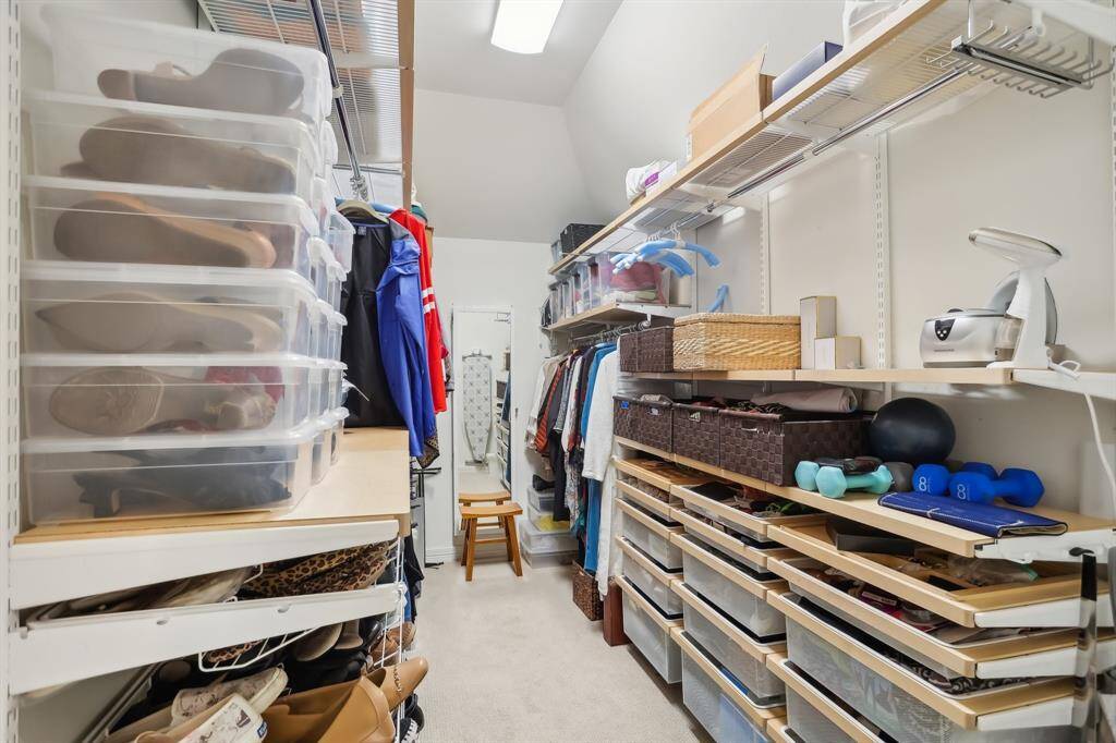 Notice the organization in "her" closet