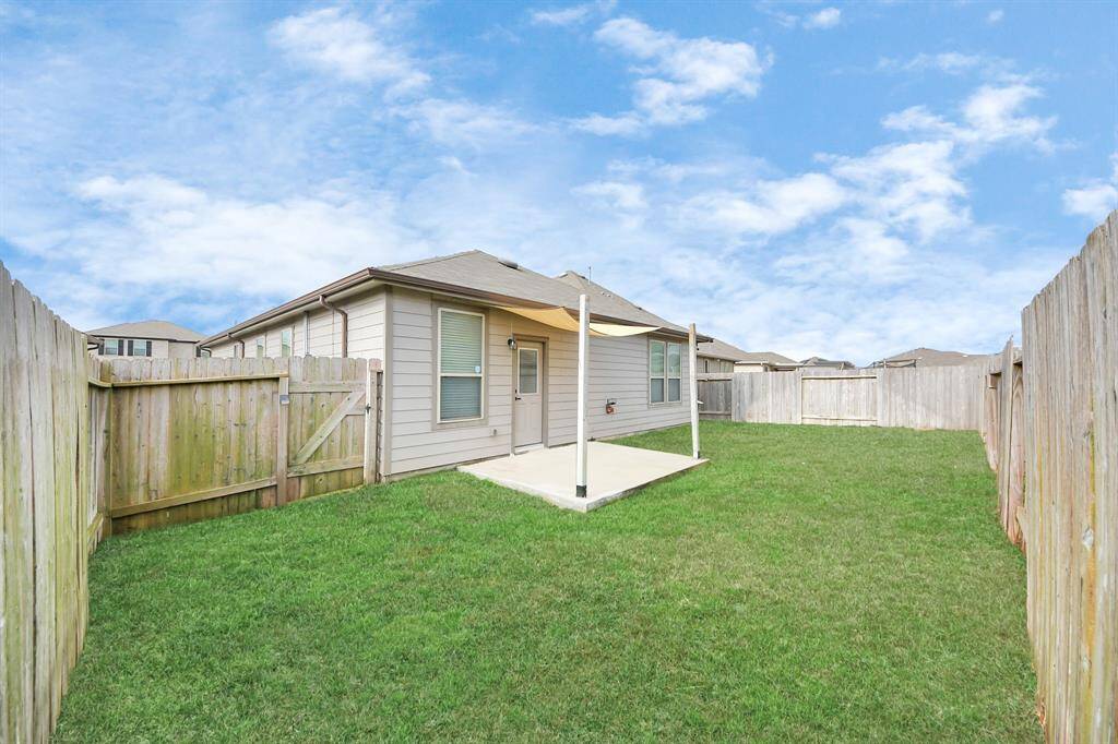 Front and rear sprinklers maintain lush landscaping. 12kW dual-fuel generator provides reliable backup power.  Extended backyard slab with sun sail creates inviting outdoor living space.