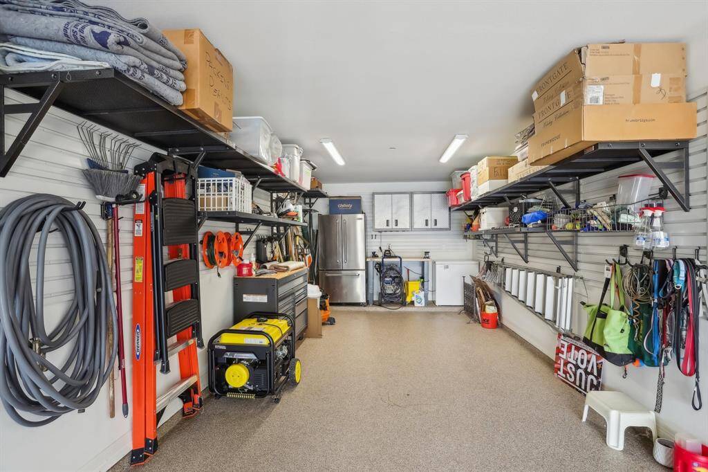 This is the tandem space for the garage. Shelving, generator and garage fridge remain with home.