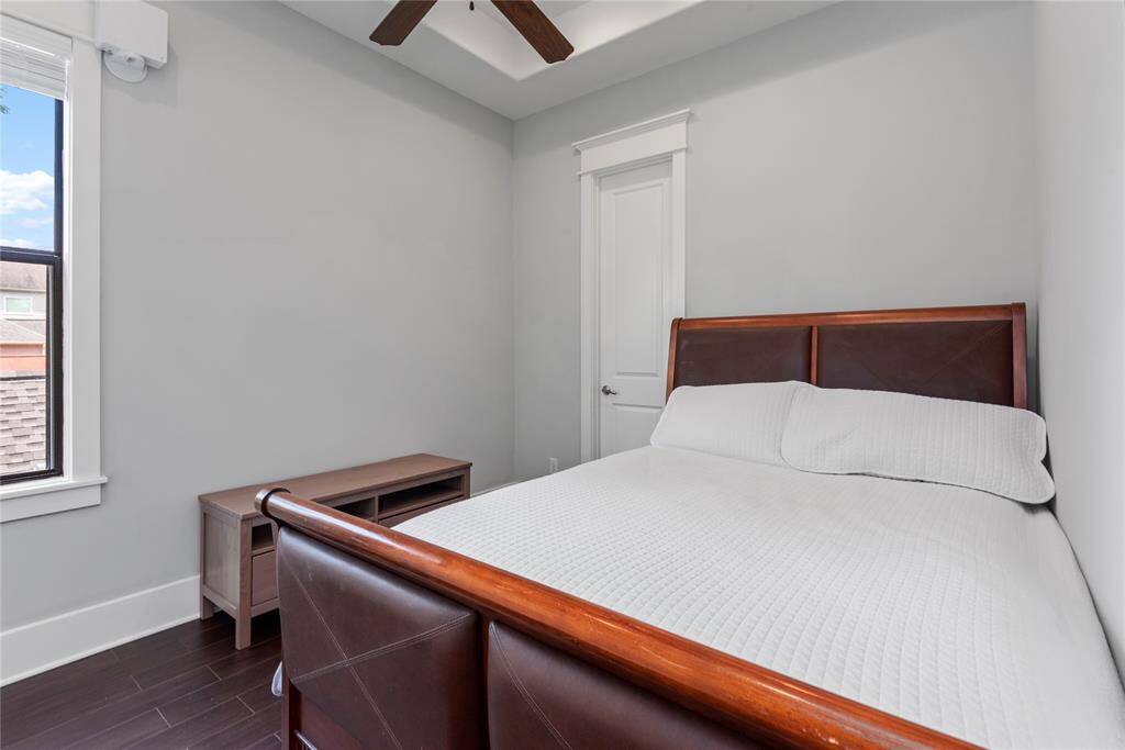 Another generously sized bedroom, offering comfort and style.