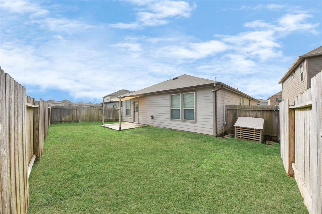 Front and rear sprinklers maintain lush landscaping. 12kW dual-fuel generator provides reliable backup power.  Extended backyard slab with sun sail creates inviting outdoor living space.