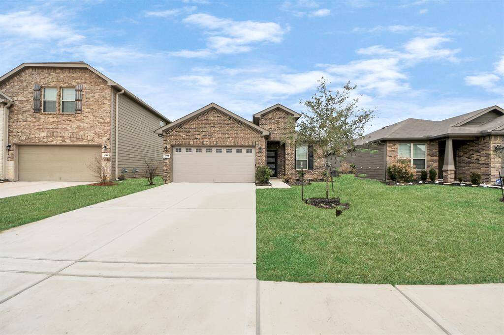 Front and rear sprinklers maintain lush landscaping. 12kW dual-fuel generator provides reliable backup power.  50AMP EV/Tesla charging station caters to modern electric vehicles.  Natural gas hookup offers eco-friendly energy option.  Exquisite custom front door welcomes you in style.