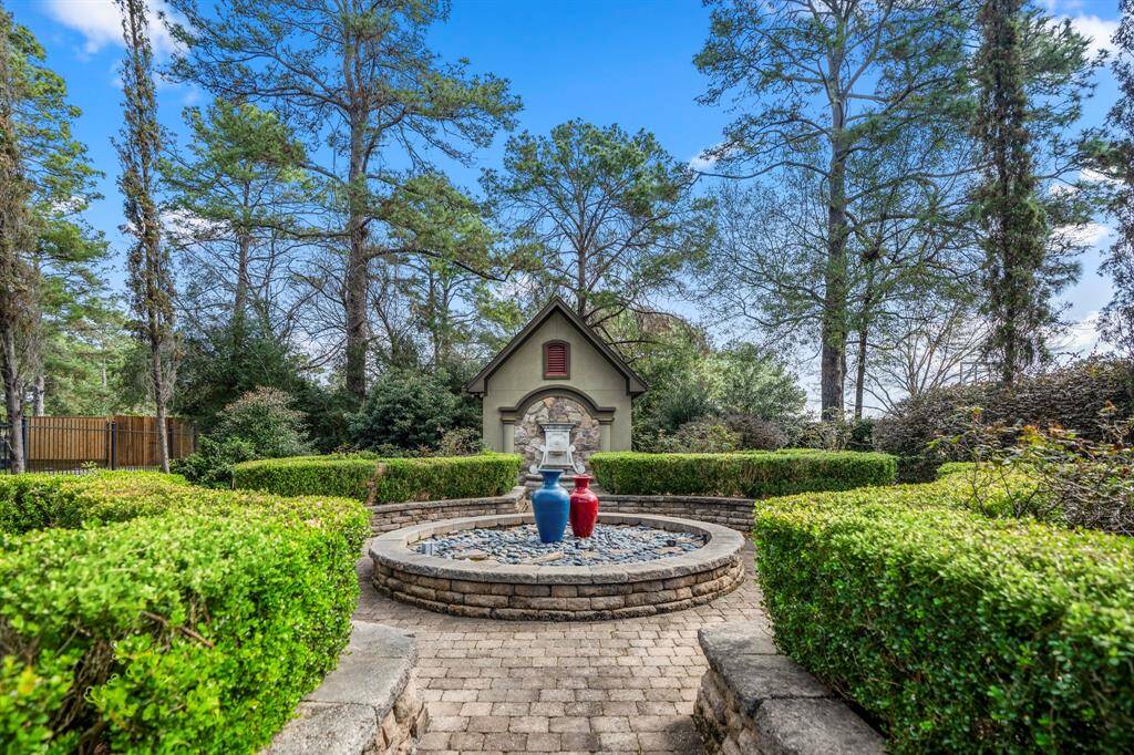 Strolling the grounds of the home, you will feel completely Zen in the classic style country garden. One of the fountains at the back is attached to a storage building, which could also be used to house a golf cart.