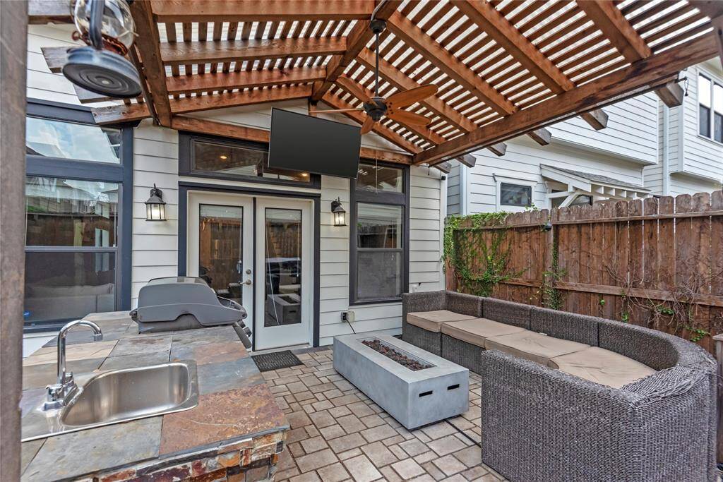 A charming outdoor seating area in the backyard, perfect for relaxing and socializing.