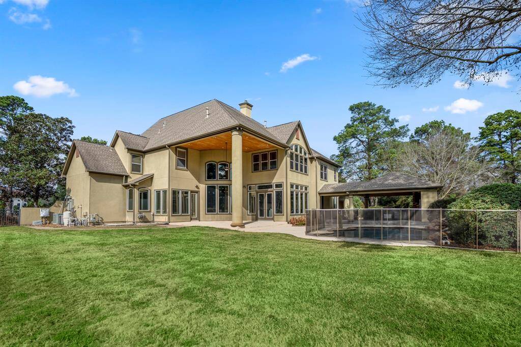 Thoughtful landscaping surrounding the pool and patio with no views being obstructed of the golf green, creates a majestic visual transition between the house, the patio, the yard and the golf course.