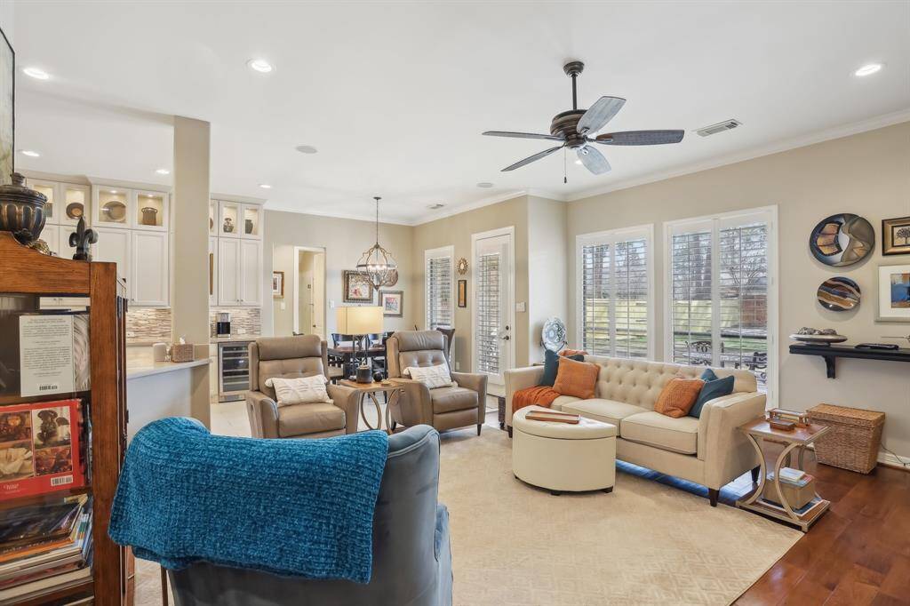 Spacious family room with plenty of natural light, wood flooring and adjacent to large kitchen.