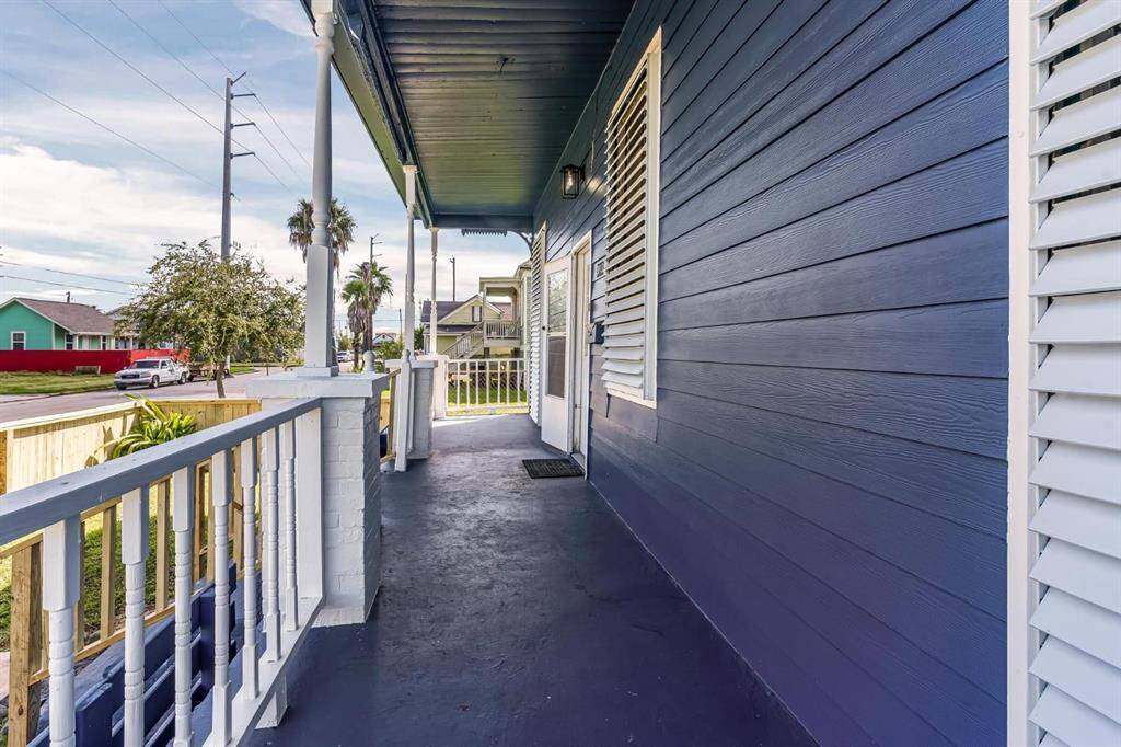Charming front porch perfect for enjoying sunrise coffee with refreshing ocean breezes.