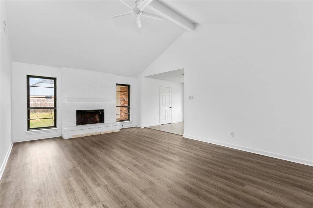 Living room with vaulted ceilings.