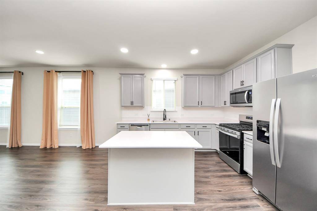 Kitchen - Premium Stainless Steel Farmhouse sink. Recessed light additions. Under-counter lighting additions
