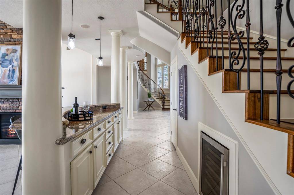 An absolutely wonderful use of space, this dry bar offers tons of storage as well as a wine / beverage refrigerator that is strategically located for convenience.