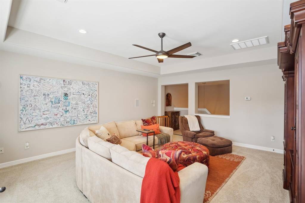 Upstairs bonus room makes for a great get-away and a movie night or play space for the kids!