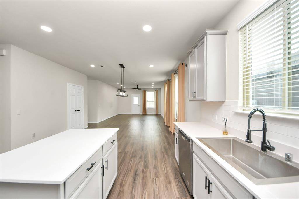 Kitchen - Premium Stainless Steel Farmhouse sink. Recessed light additions. Under-counter lighting additions