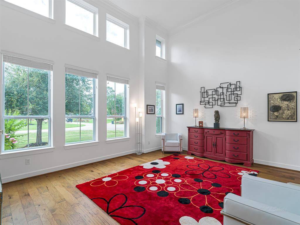 There is plenty of natural light in the living room and soaring 2-story ceilings