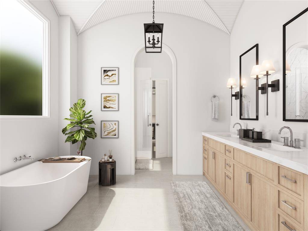 An expansive primary bathroom that offers spa-like relaxation. The generous layout accommodates dualvanities, a soaking tub, and a walk-in shower. With premium finishes and thoughtful design, this is theultimate retreat for unwinding after a long day.