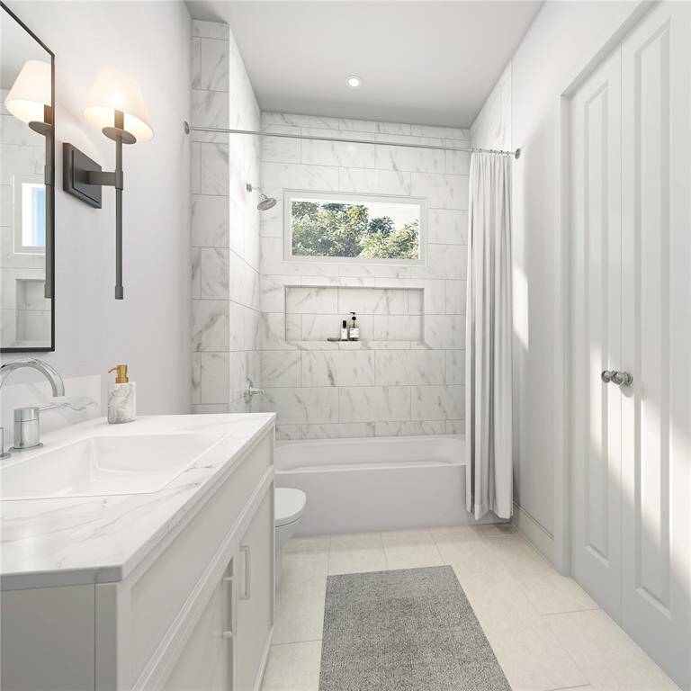 A convenient secondary guest bath with a thoughtful layout. Designed for comfort and efficiency, thisspace is perfect for accommodating family or visitors while maintaining the home's aesthetic.