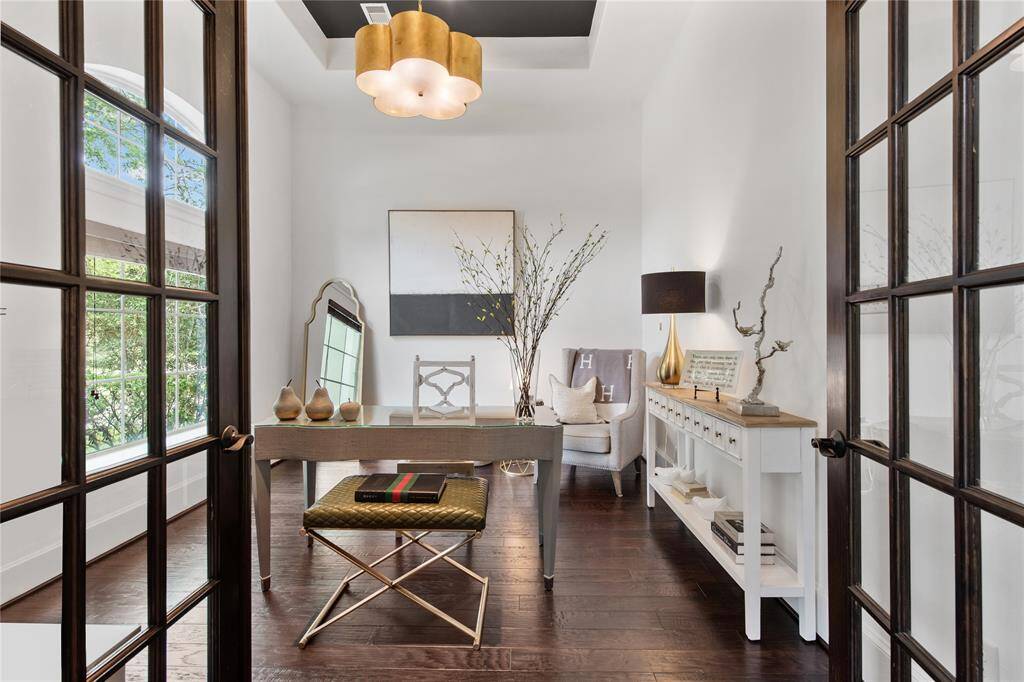Front facing formal study with double glass french doors.