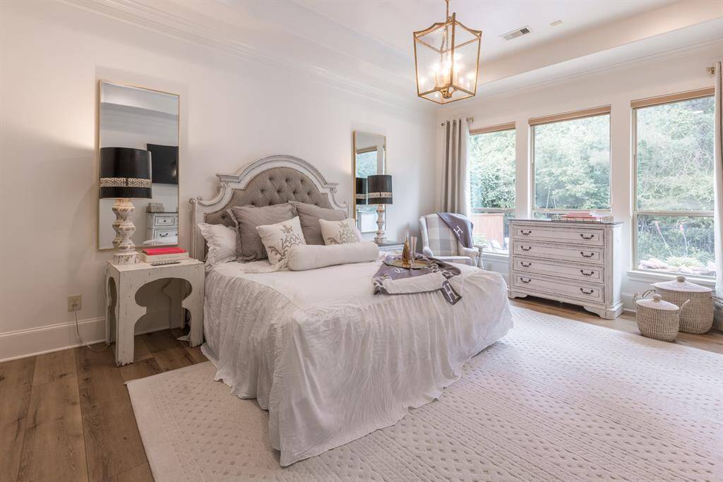 Stunning owners retreat with new flooring. Lots of windows allowing for natural light and views of the backyard.