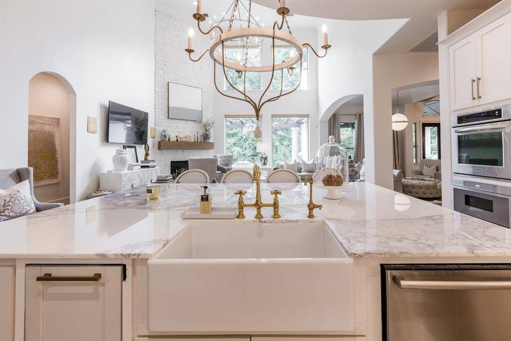 Oversized island with Marble counter top. Open and full of natural light creating an airy and open atmosphere!