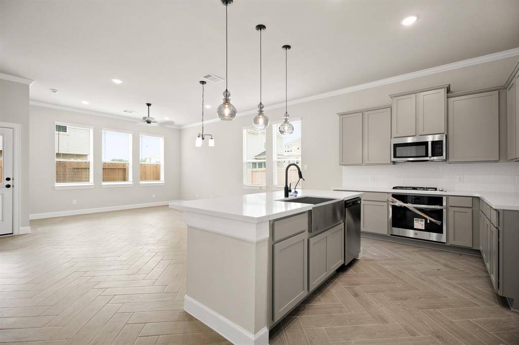Light grey cabinets and quartz countertops in the kitchen - still under construction!