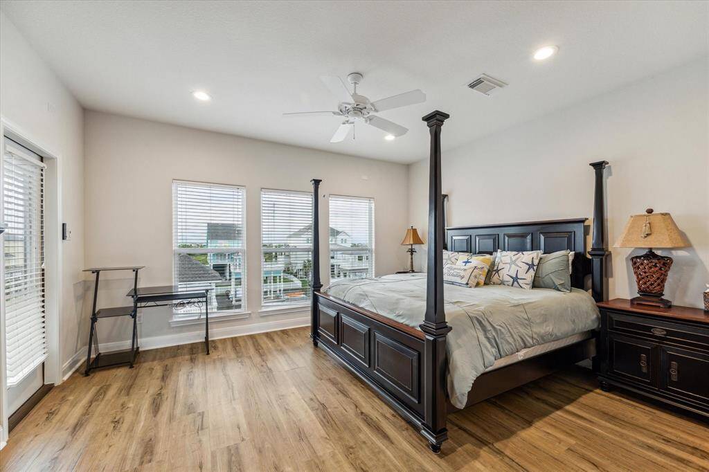 Upstairs is the primary suite with its private deck