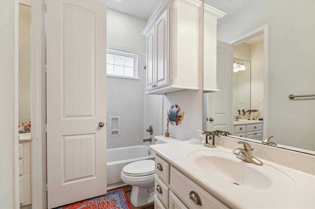 Upbeat Jack and Jill features tub and shower and separate dressing area