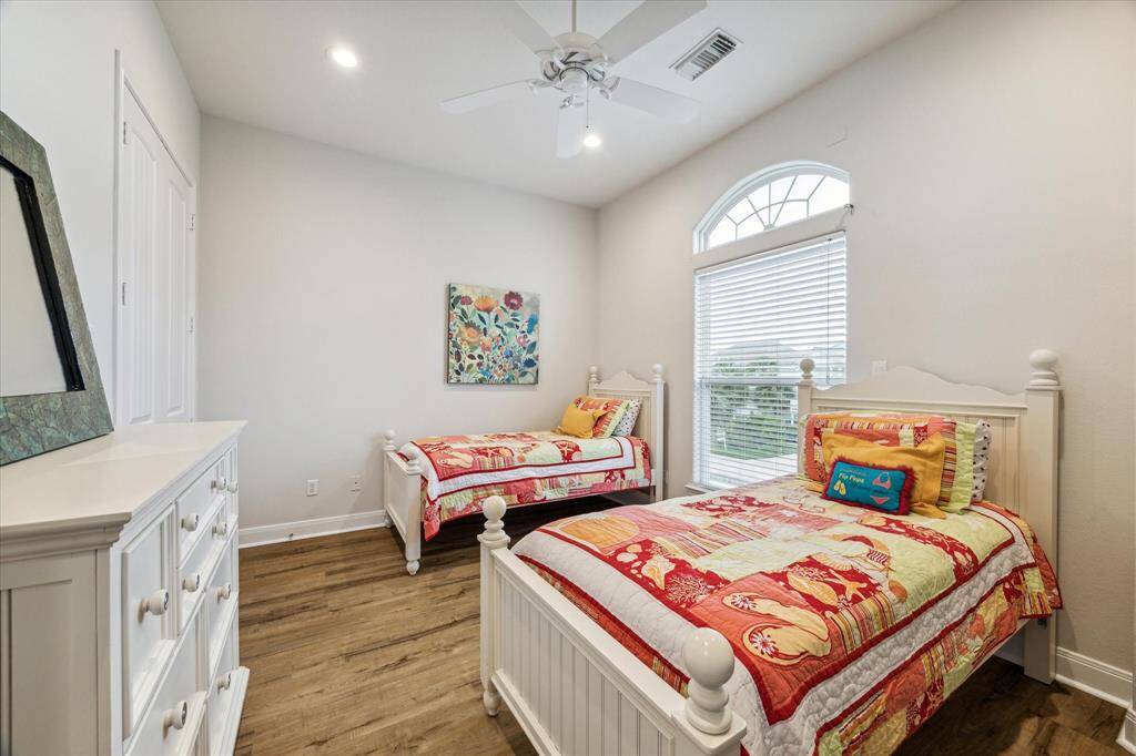Adorable twin bedroom downstairs shares jack and jill bath