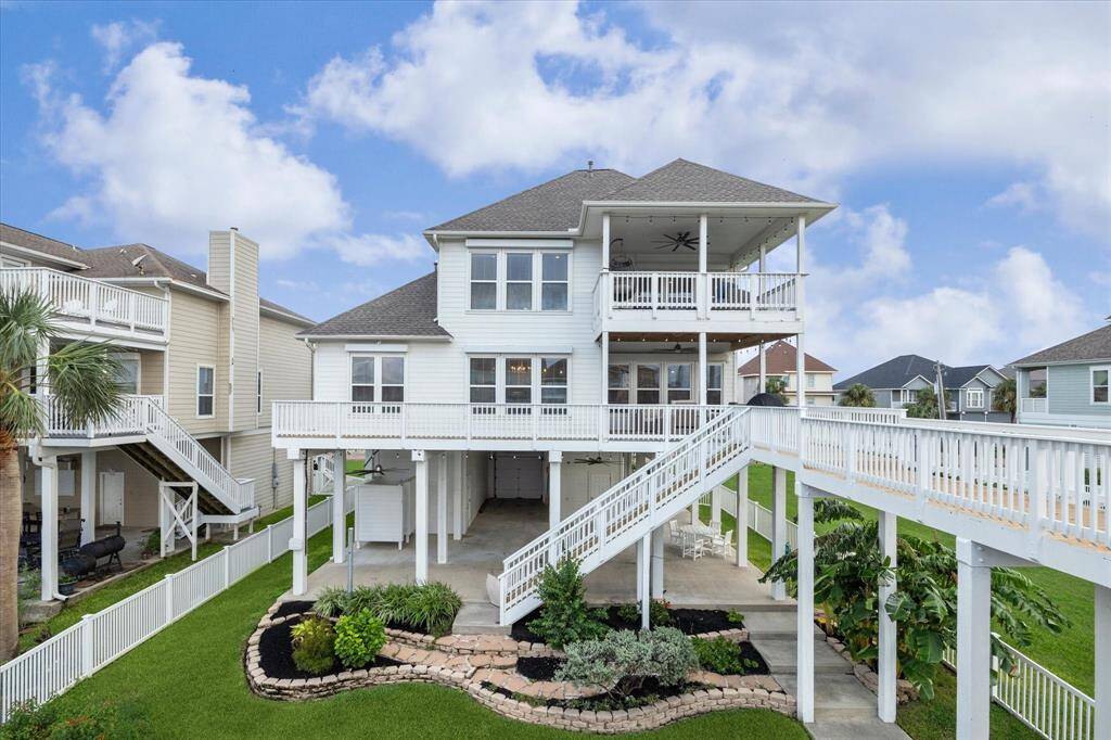 Waterside view is just as beautiful as the street side view.  Notice the new roof, backstairs, catwalk, balusters and decking. Plenty of room for a pool!   All windows have electric storm shutters.