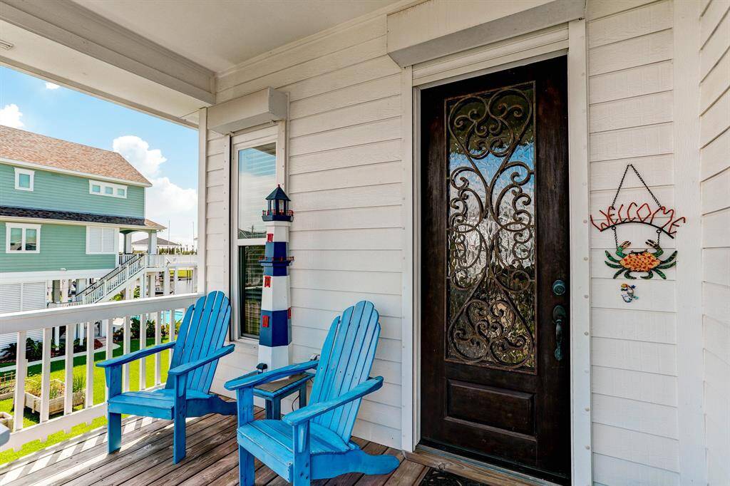 Welcome your guests to your new Laffites home and enjoy this porch for 'front porch living'