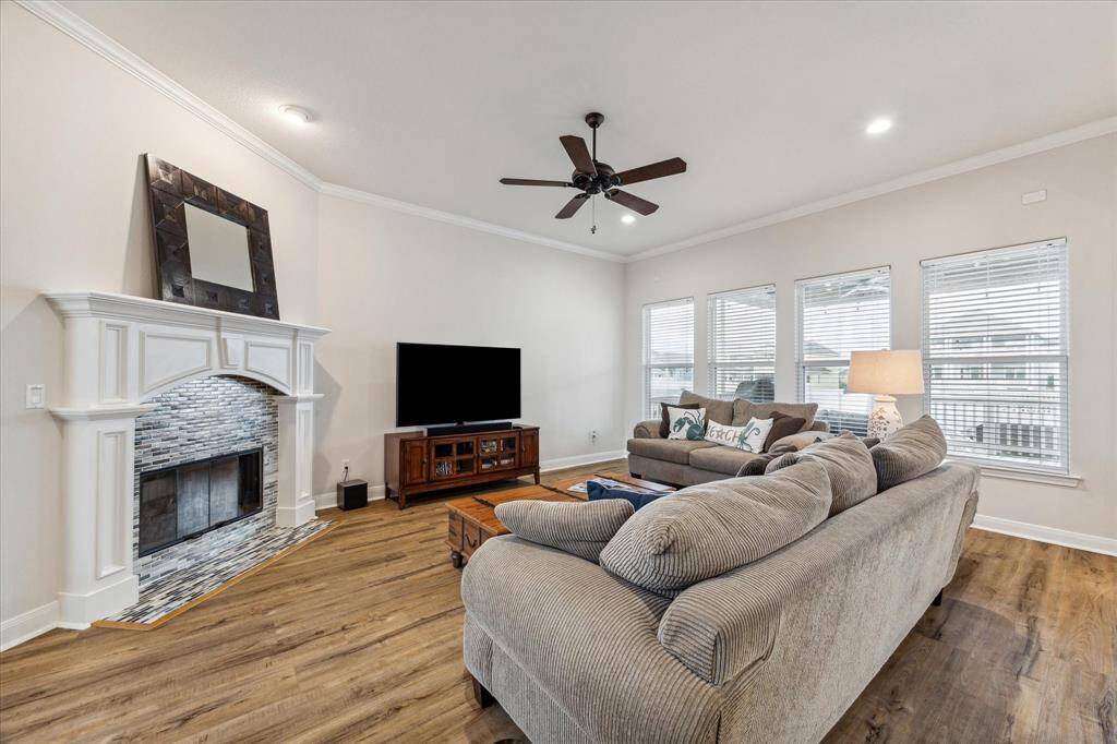 Spacious living room for entertaining.  Rich floors underfoot throughout , no carpet.