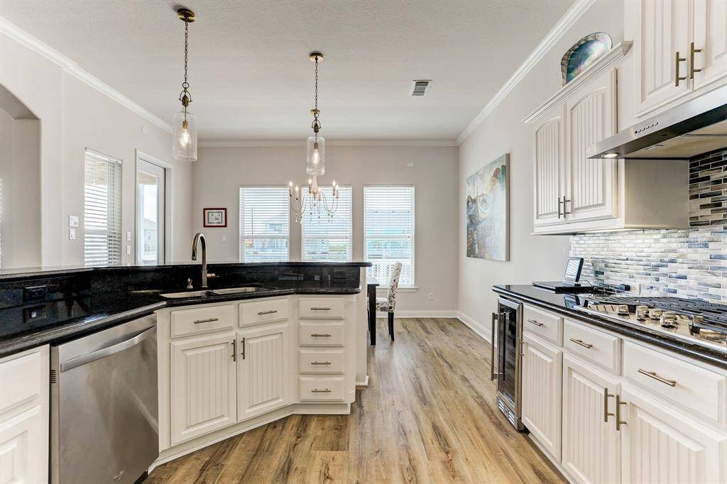 Recent stainless appliances and hardware, wine cooler and 5 burner gas cooktop
