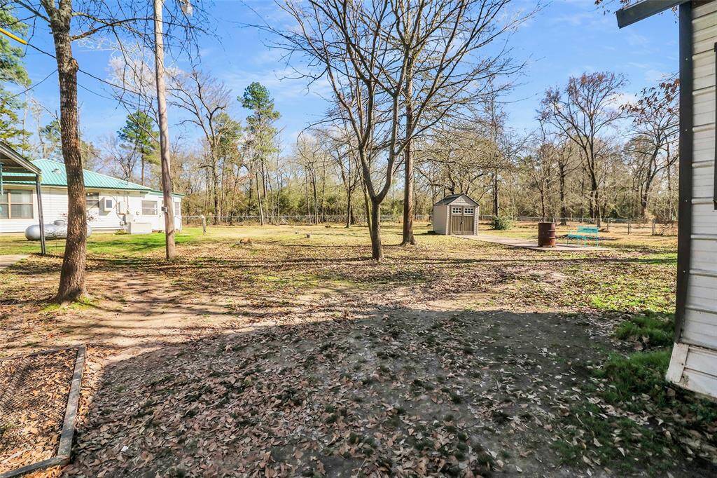 Conveniently located next to the garage, the shed is equipped with electricity and a 3/4 bath, offering versatile functionality.