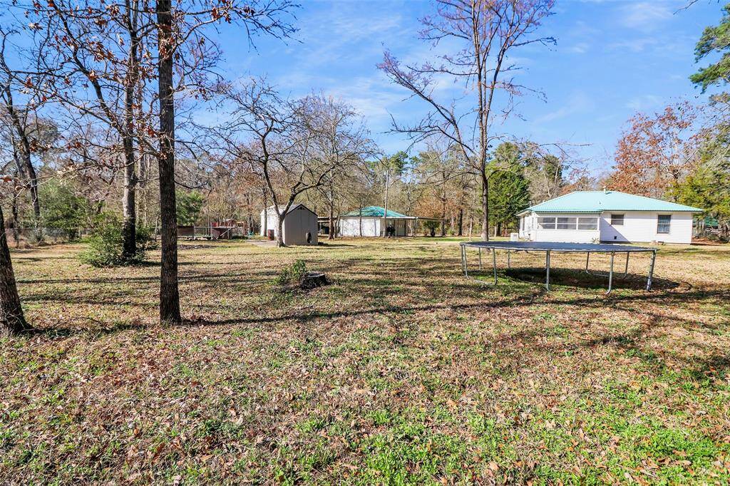 Expansive 3-acre property with cross-fencing, featuring a detached garage and a versatile shed/office complete with a 3/4 bath.